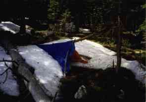 JD's blue tarp camp in snowdrift