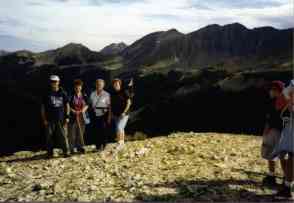 Family pose with site behind